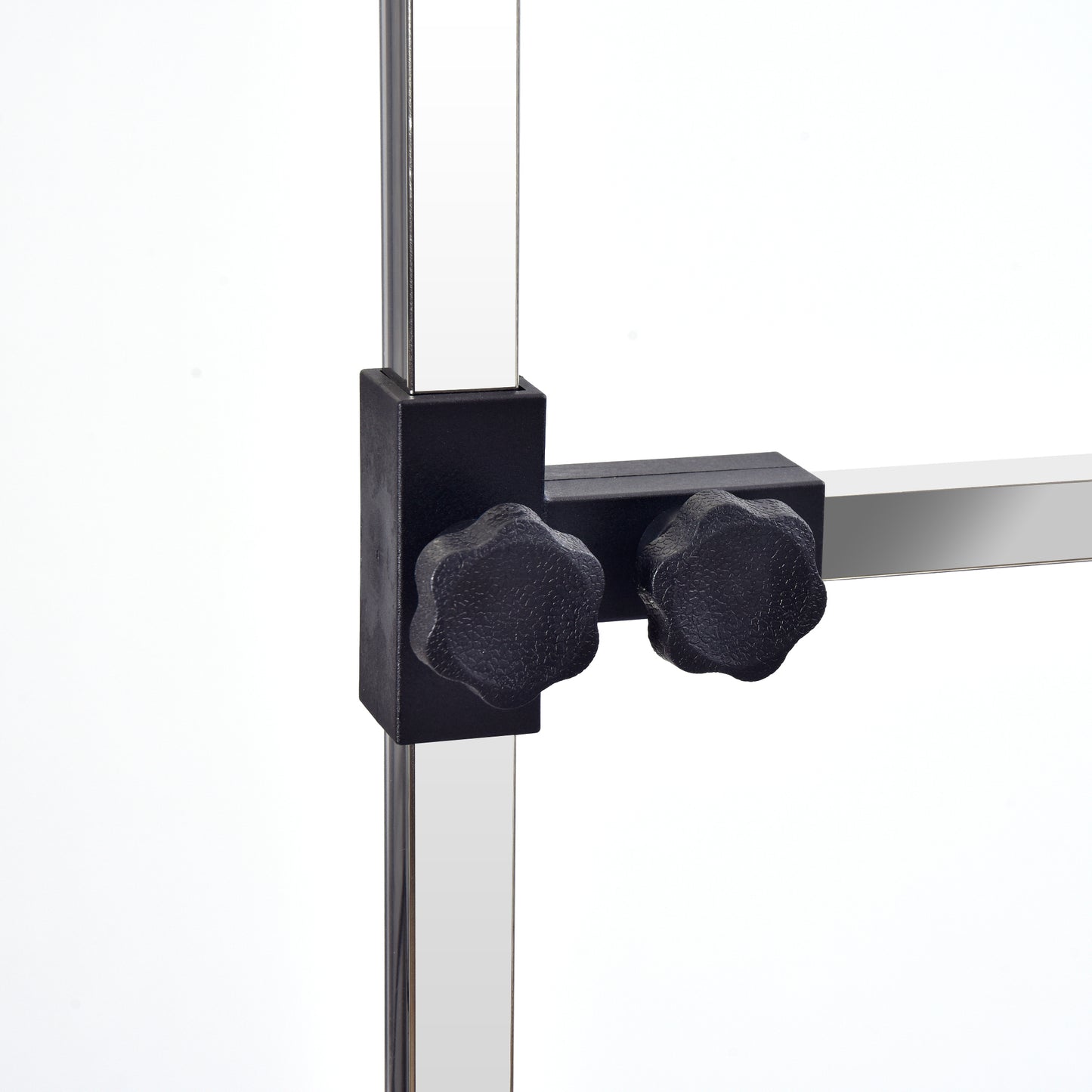 Closeup of adjustable black knobs on a chrome stand for precise height setting