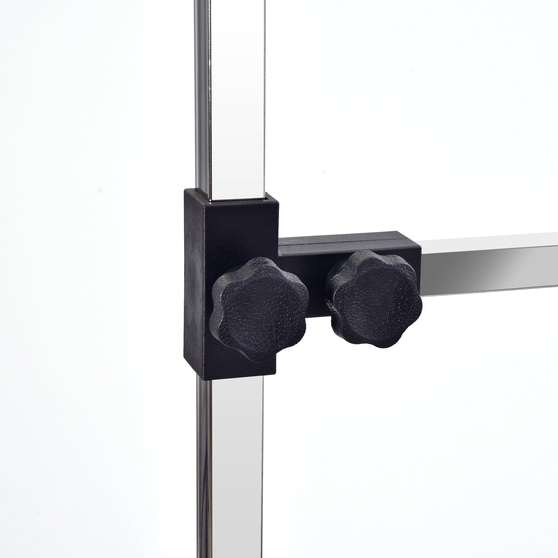 Closeup of adjustable black knobs on a chrome stand for precise height setting
