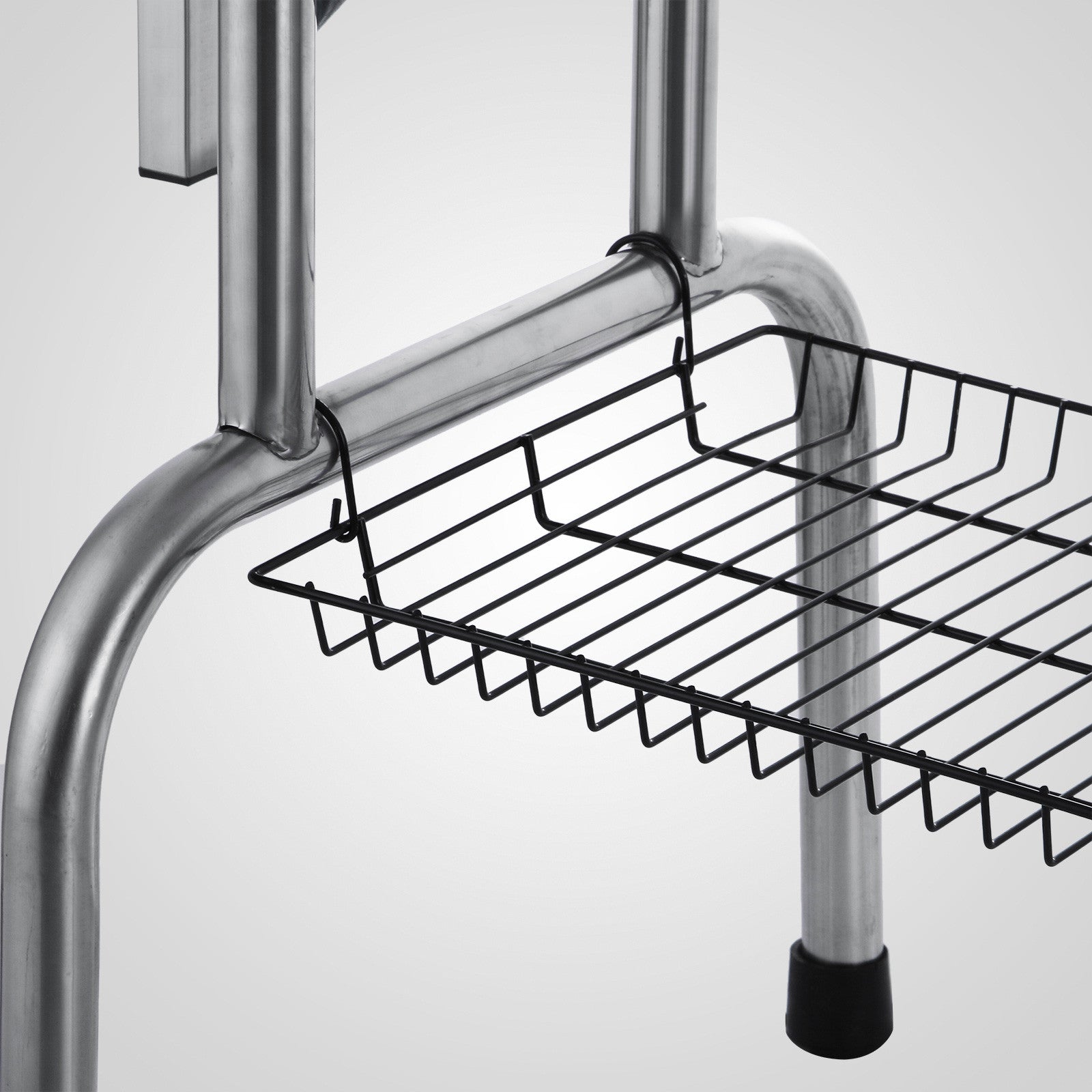 Chrome metal shelf unit with hanging black wire basket for organization