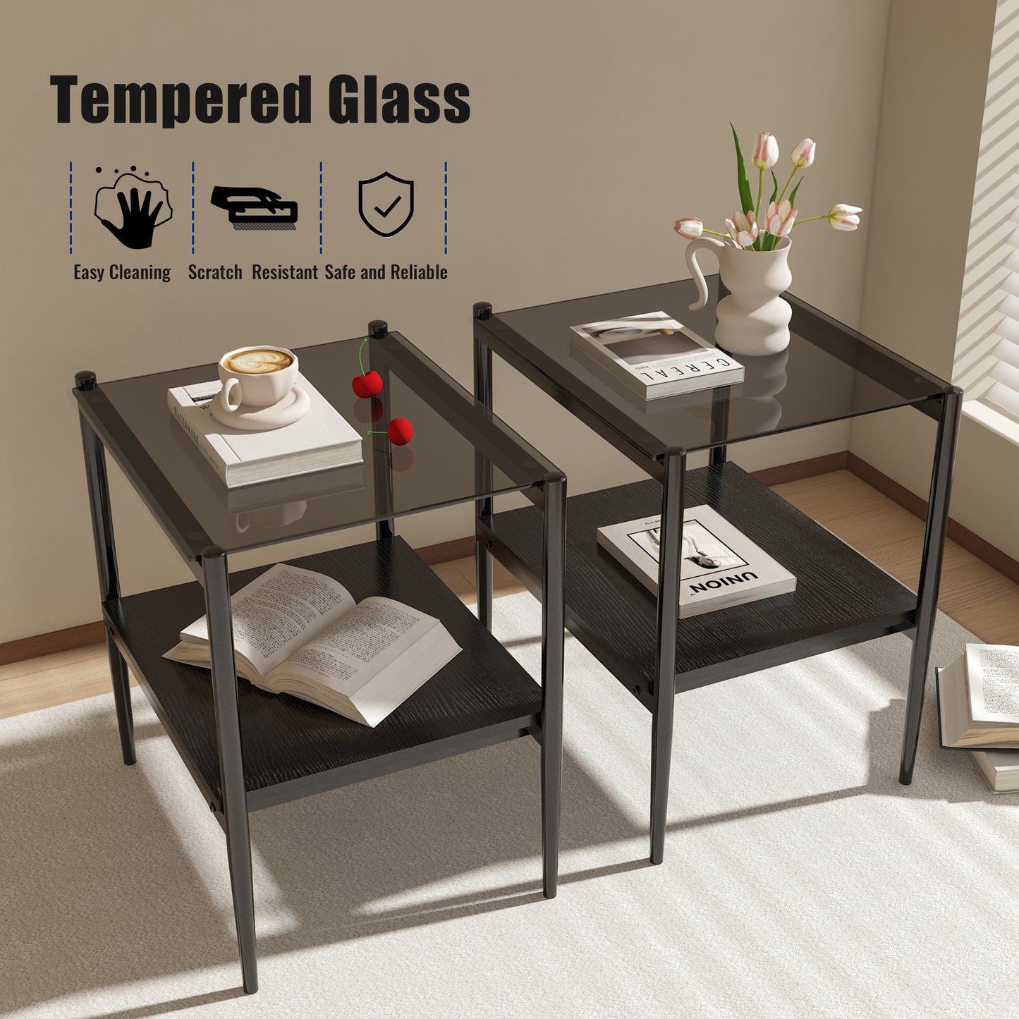 Two black metal end tables with dark tempered glass tops and black wood shelves