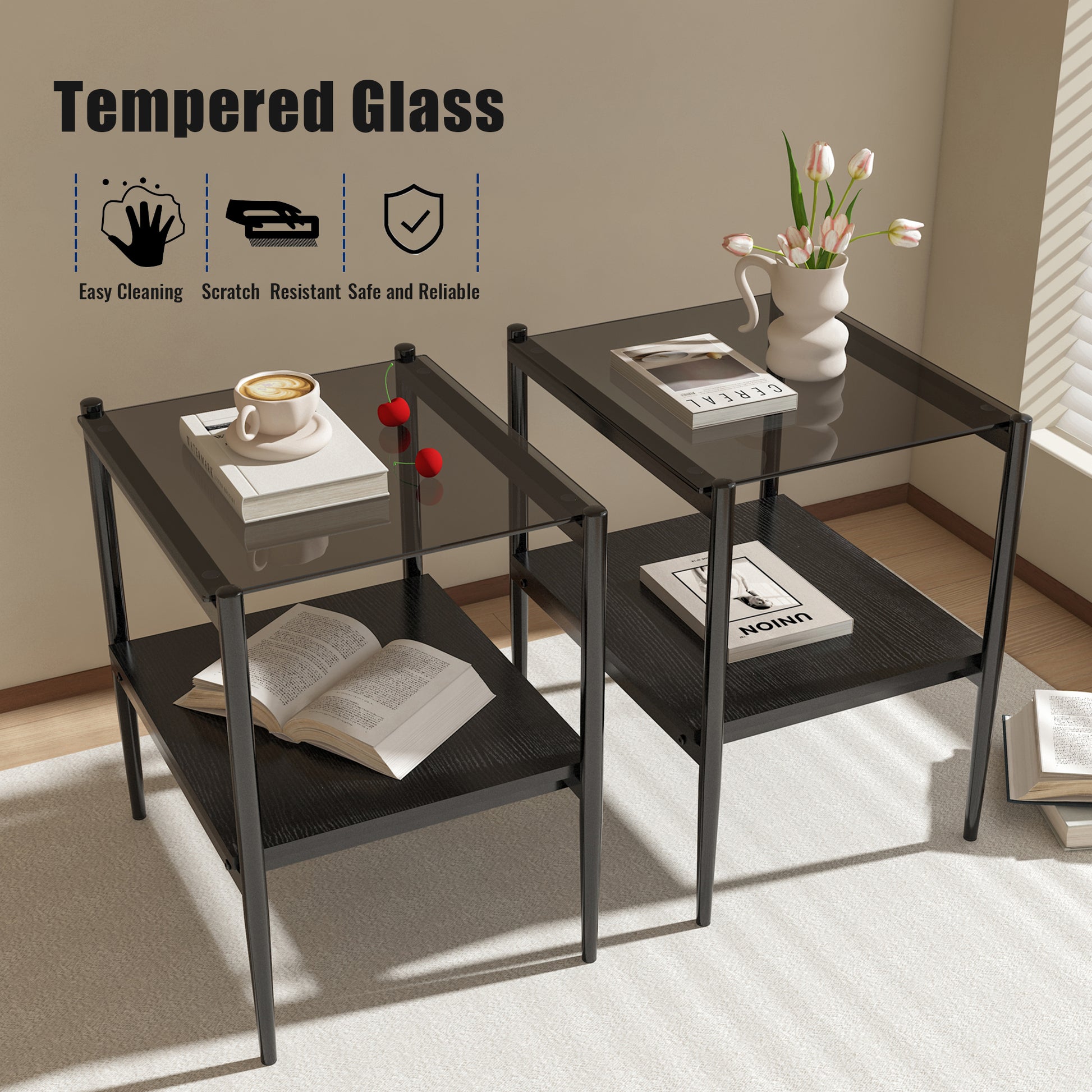 Two black metal end tables with dark tempered glass tops and black wood shelves