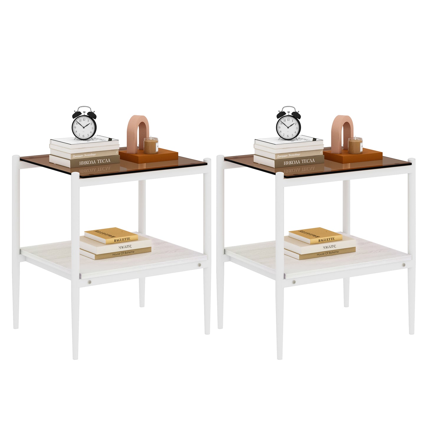 Two minimalist white metal side tables with glass tops displaying decorative items like books and a clock