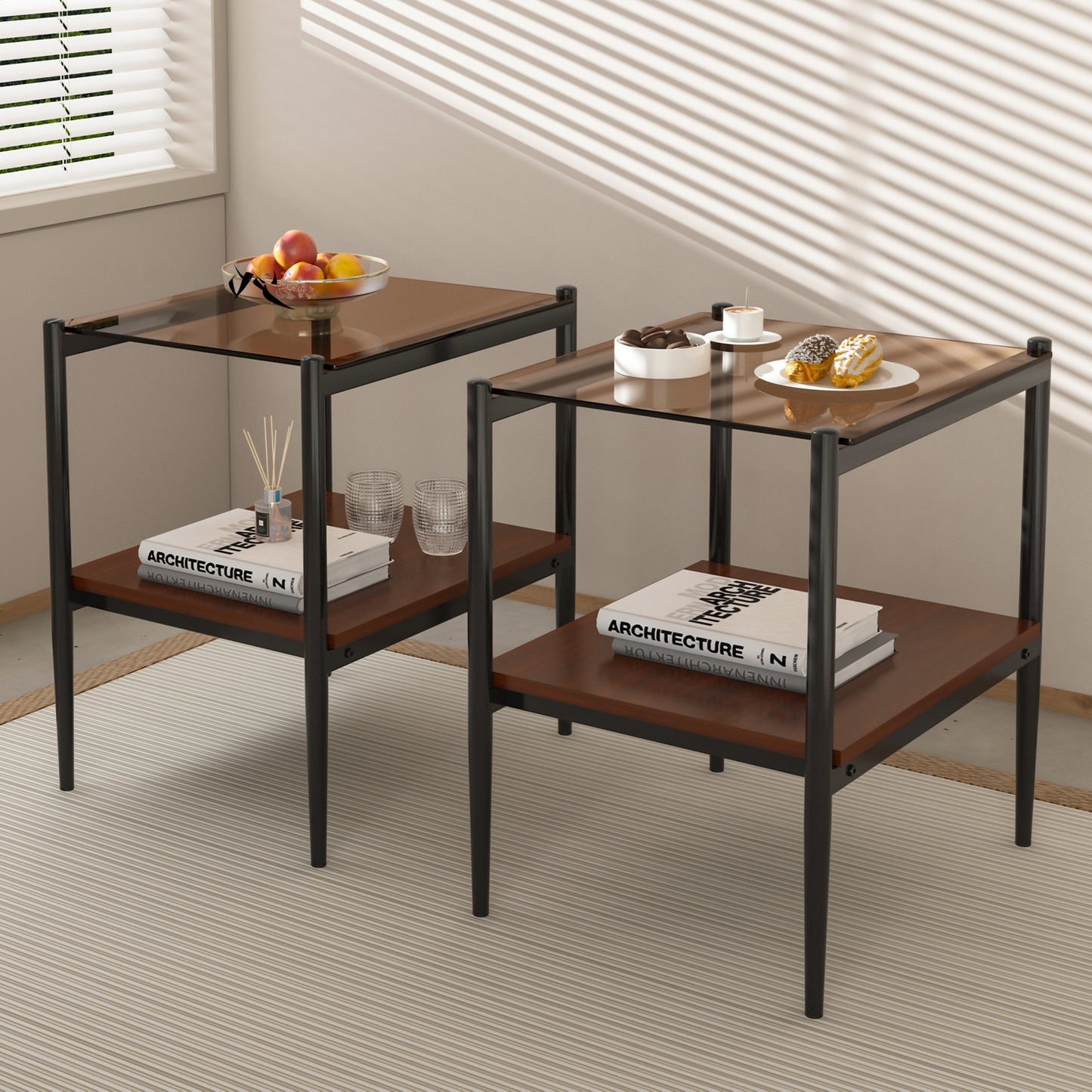 Two modern black metal end tables with dark wood shelves and smoked glass tops showcase a contemporary living room setup