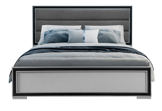 Modern upholstered grey bed frame with silver trim and blue bedding