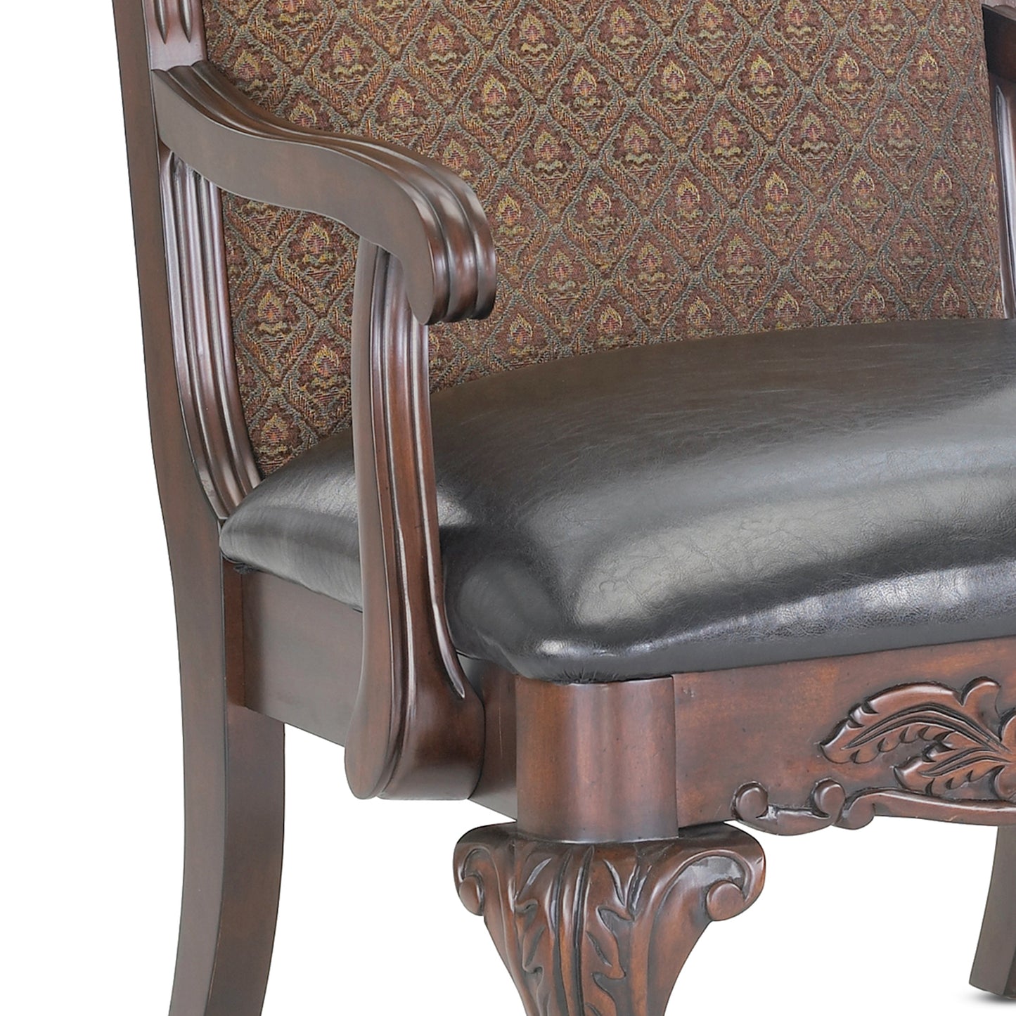 Dark brown leather armchair with ornate carved wood details and patterned fabric upholstery