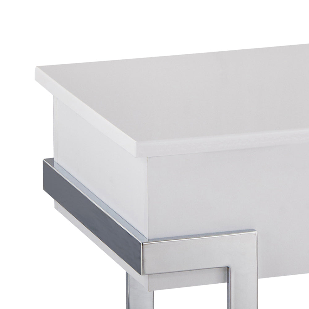 White bedside table with modern chrome legs and gray accent trim