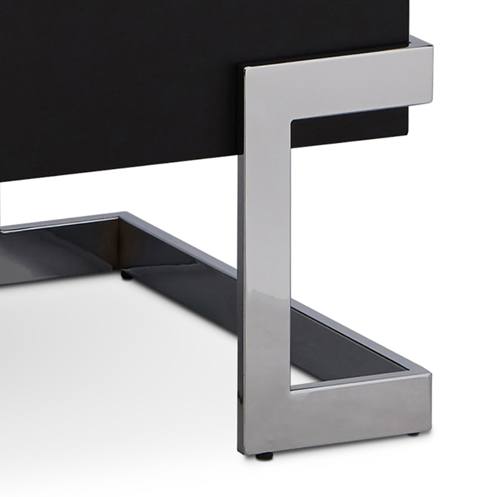Polished chrome metal frame on a black contemporary accent table