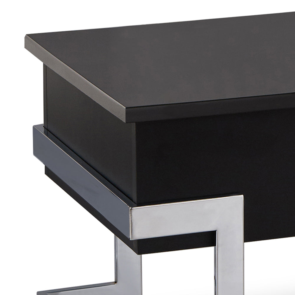 Sleek black bedside table with polished chrome legs and silver trim accent