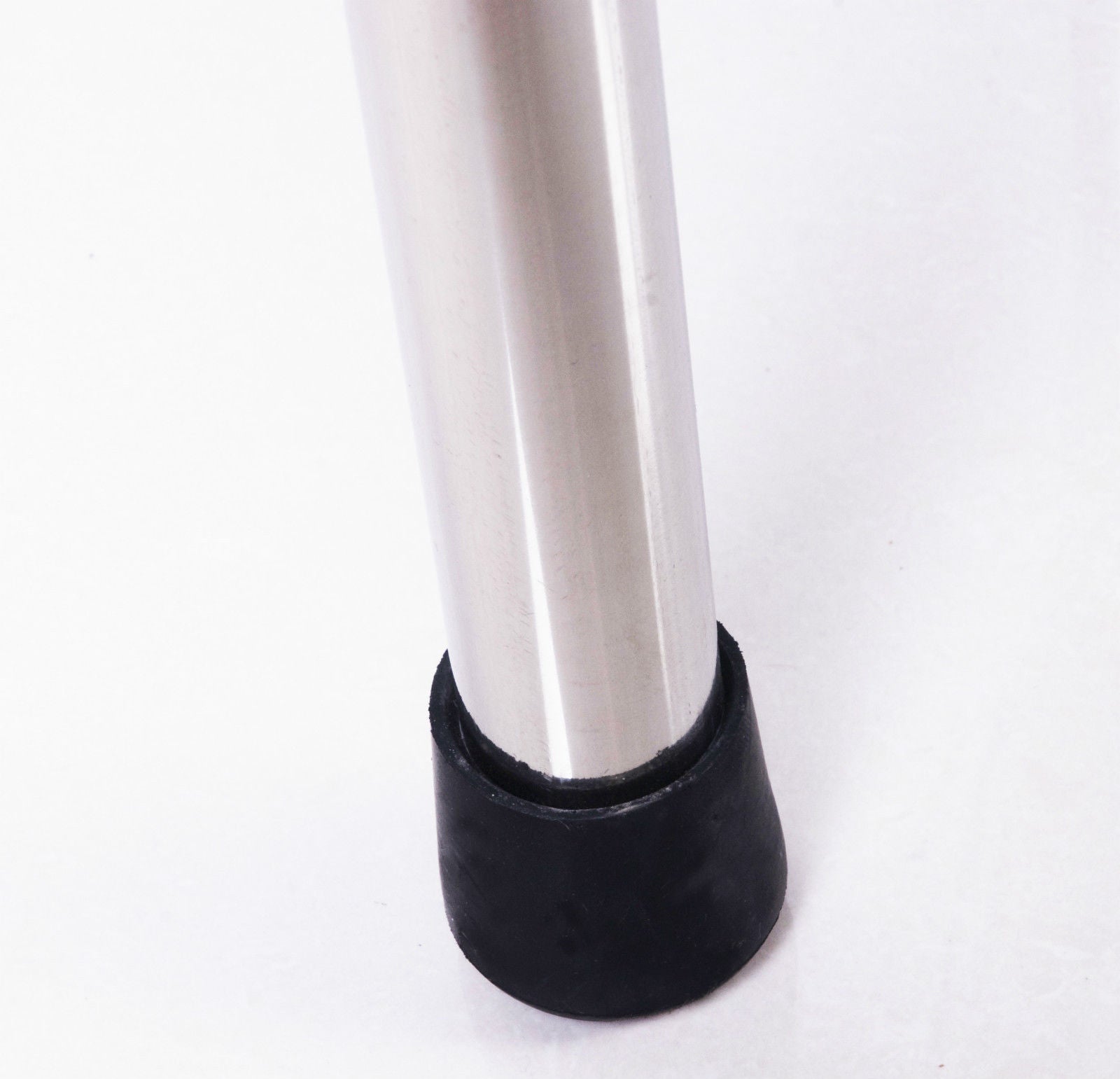 Sleek metal leg with a black rubber furniture foot for stability and floor protection