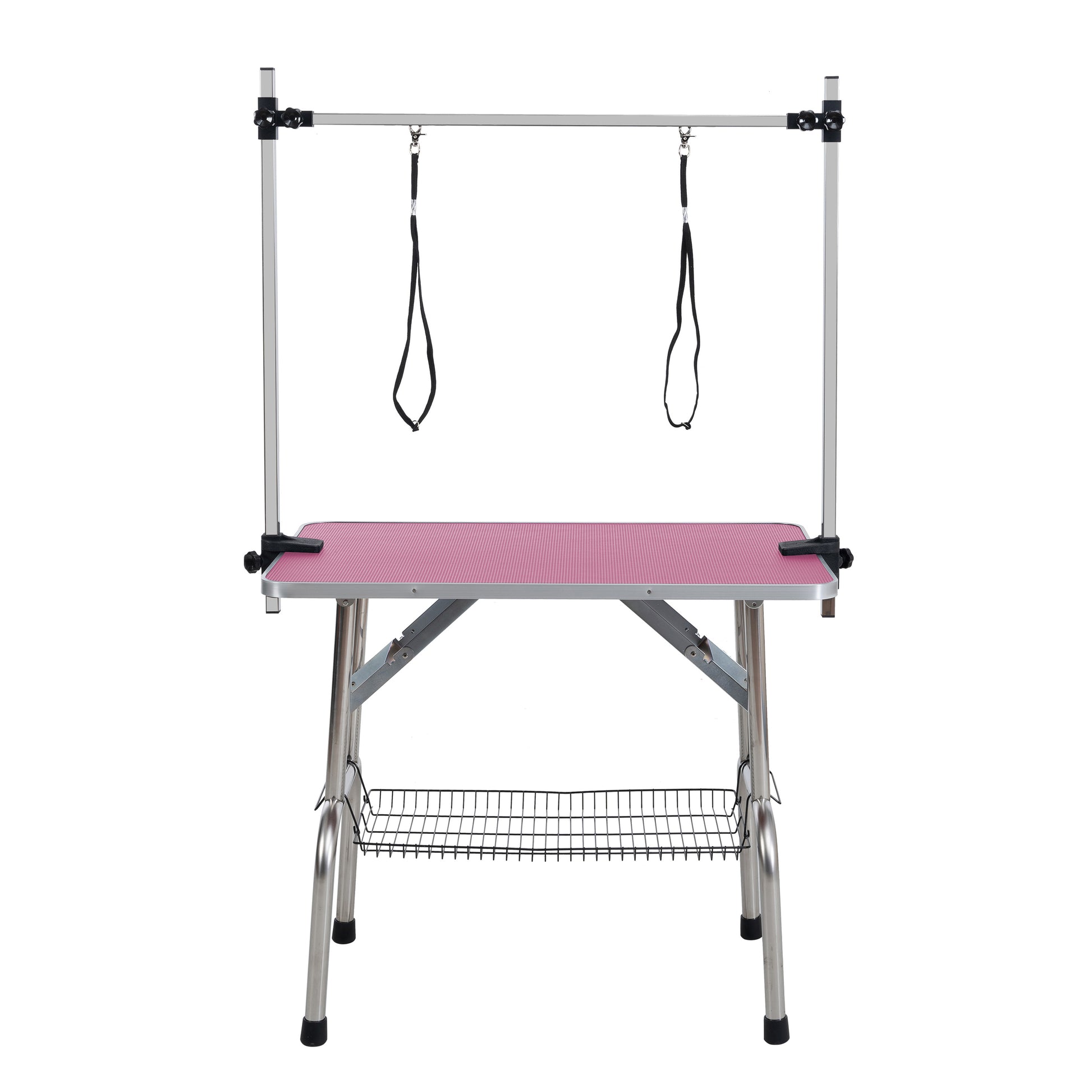 Adjustable grooming table with pink textured surface and metal frame including adjustable restraints and wire basket
