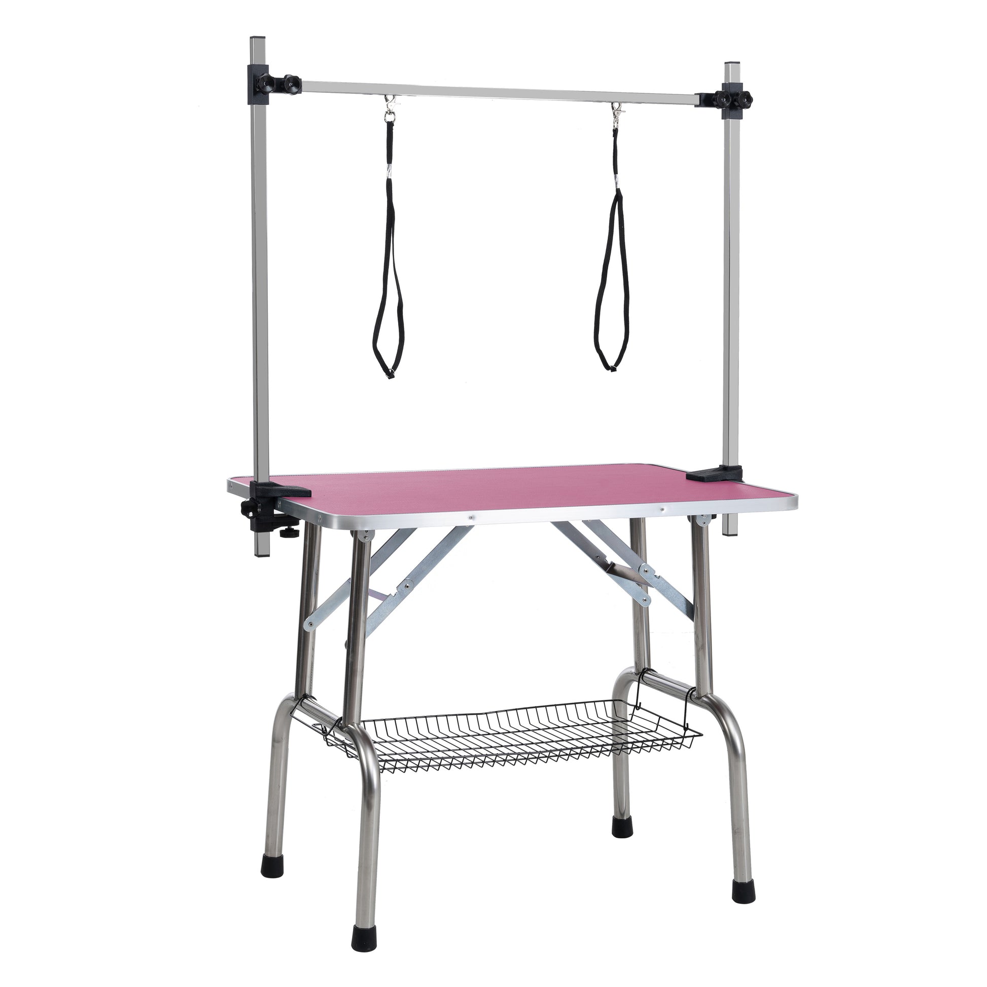 Pink grooming table with adjustable arm and two restraints featuring a wire basket underneath