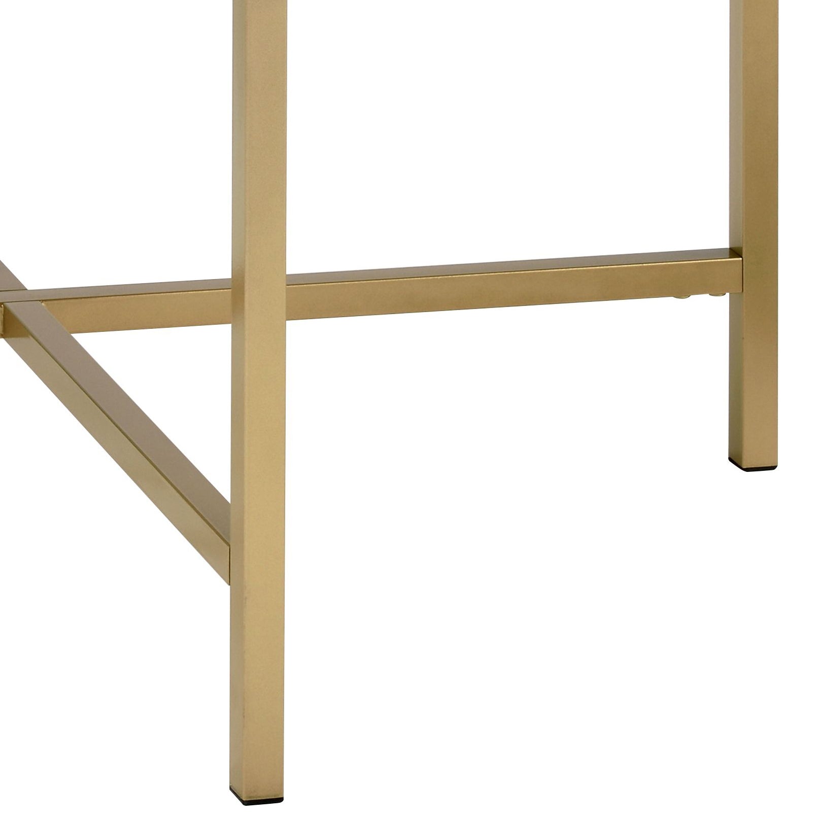 Closeup of brushed brass table legs and support beams