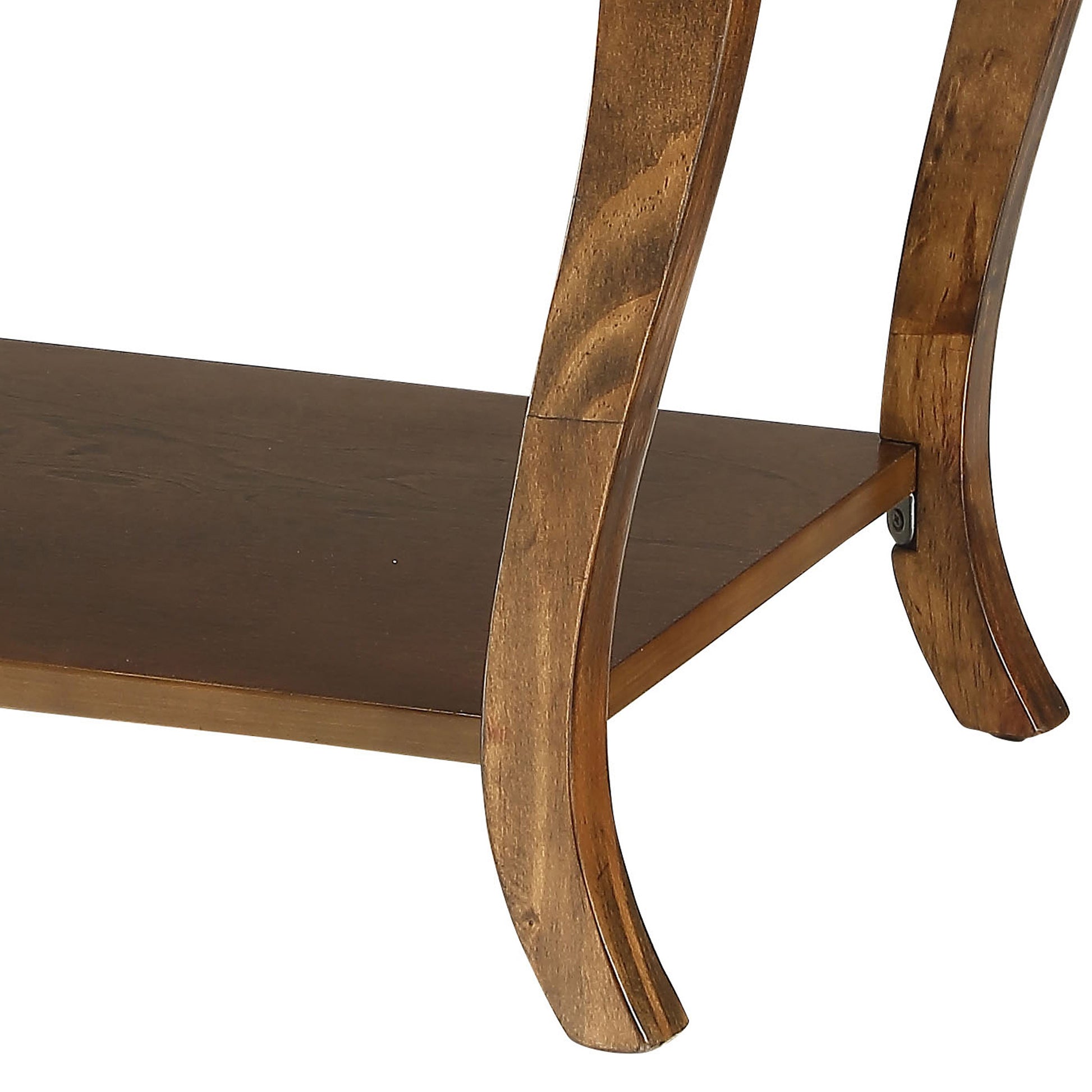 Detail of curved wooden legs and dark brown shelf on a side table
