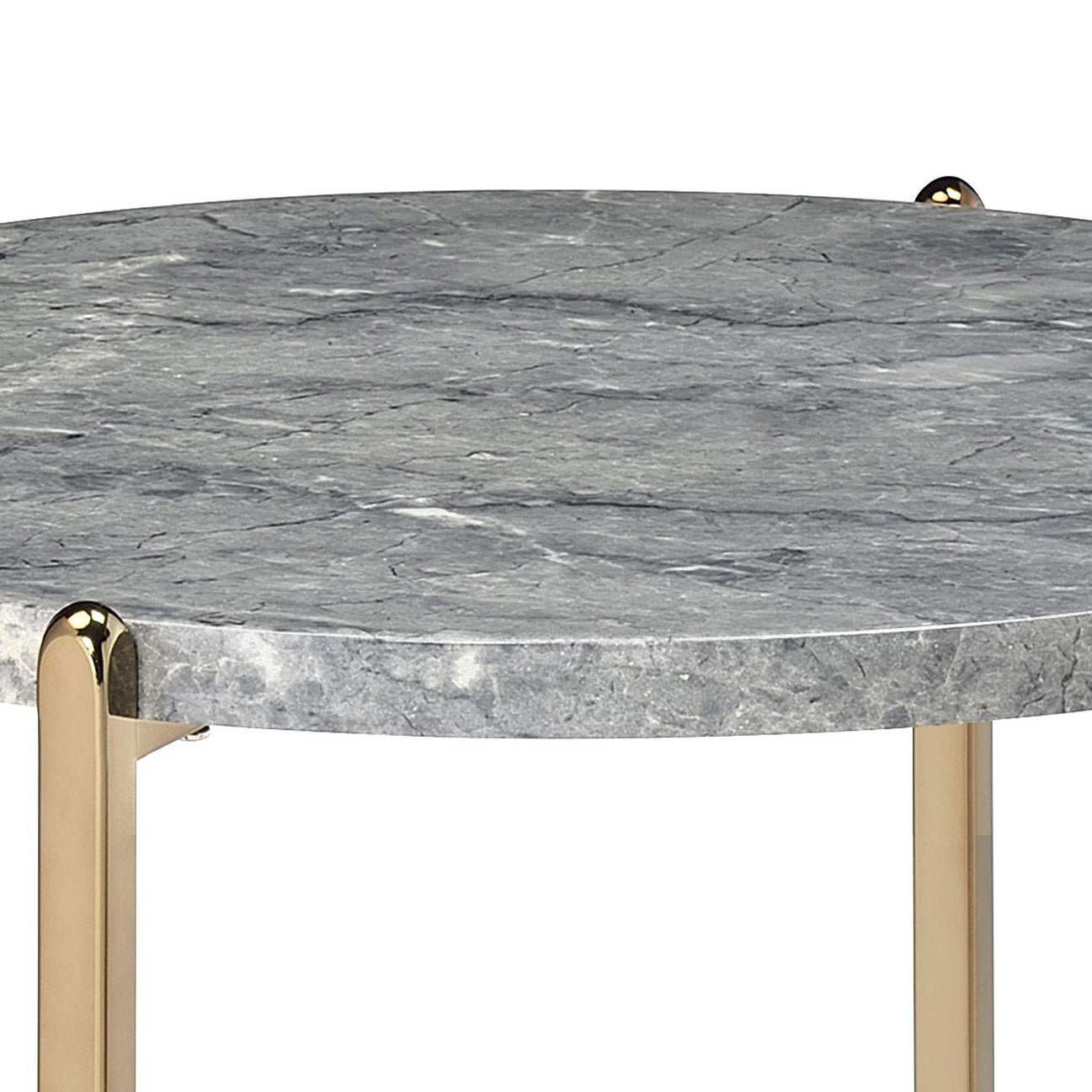 Round gray marble coffee table with polished gold legs