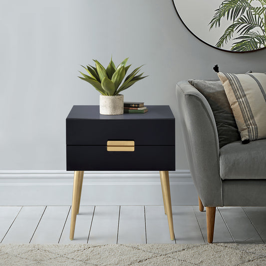 Sleek black bedside table with gold drawer pull and tapered gold legs