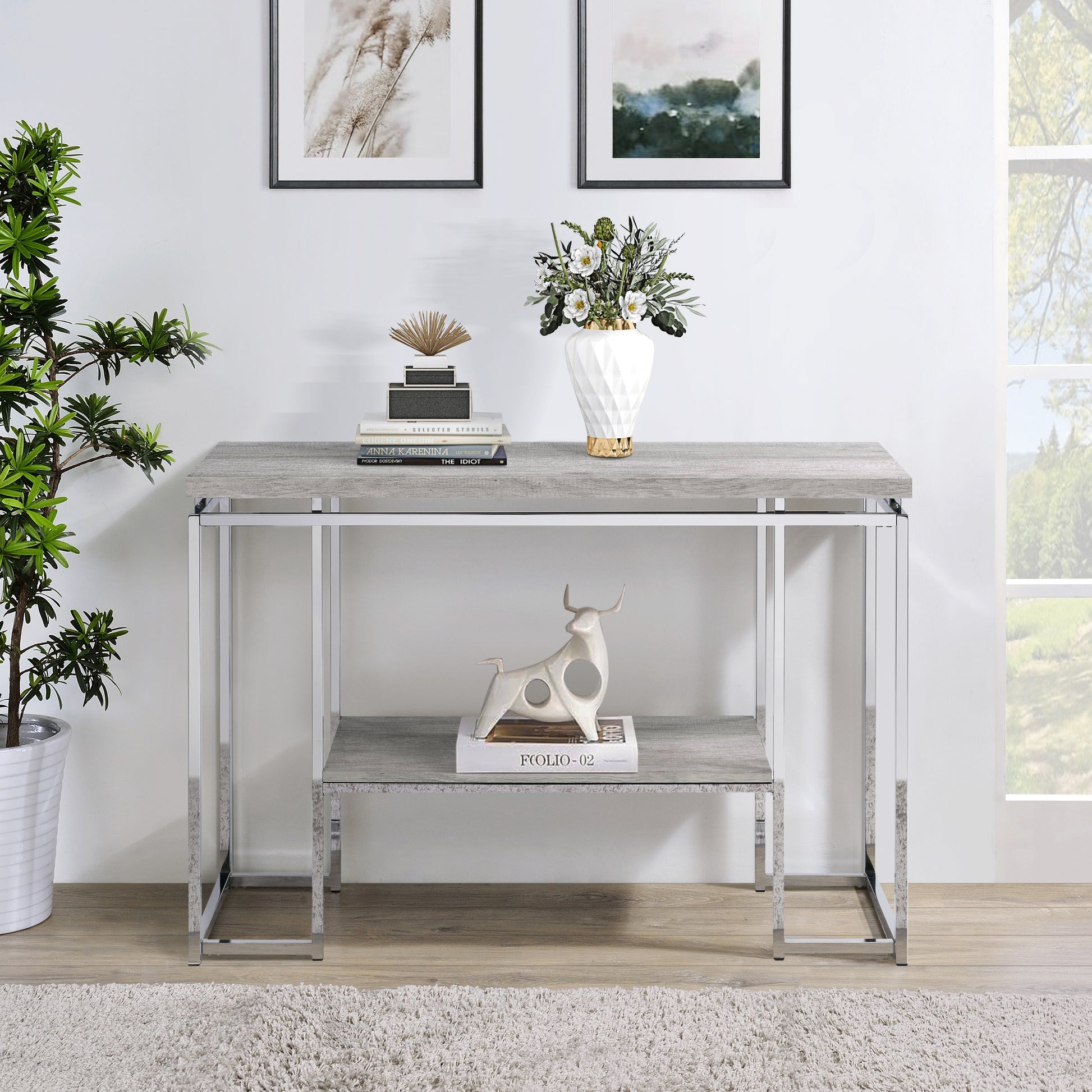 Slim profile grey wood grain console table with chrome legs and decorative bull accent