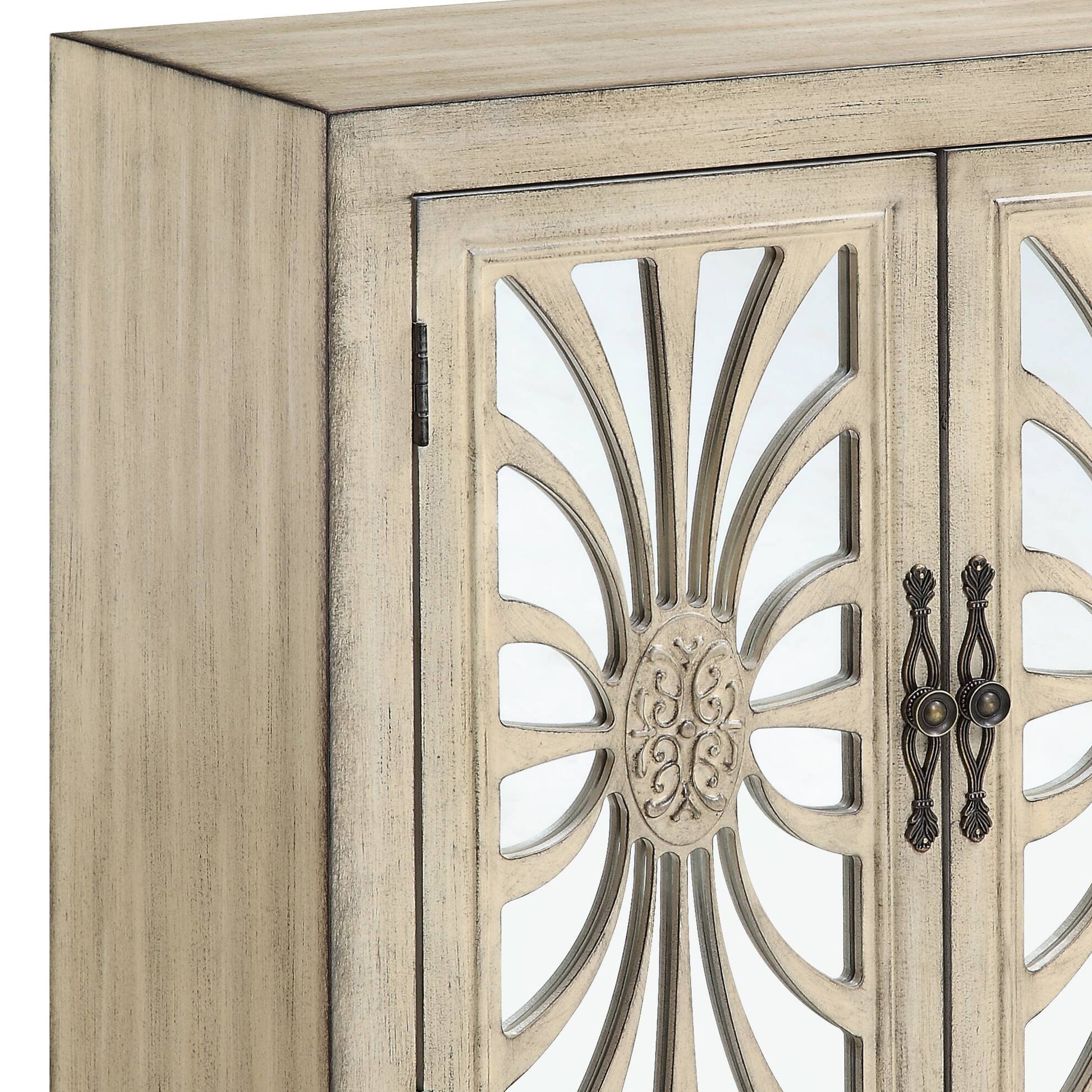 Distressed cream cabinet door with mirrored sunburst inlay and ornate handles
