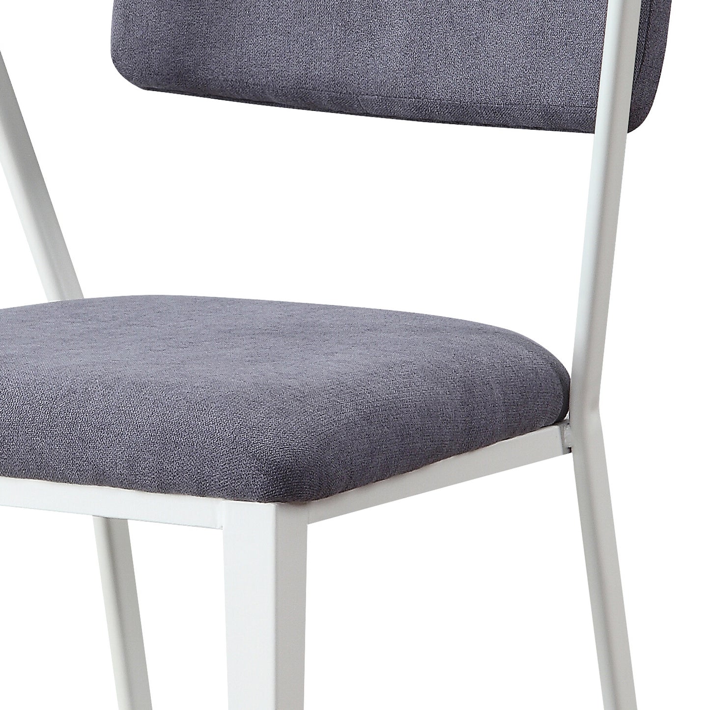 Closeup of a gray upholstered chair seat and back with white metal legs