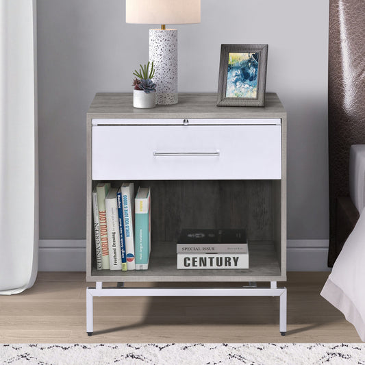 Gray wood bedside table with white drawer and open shelf a lamp and books