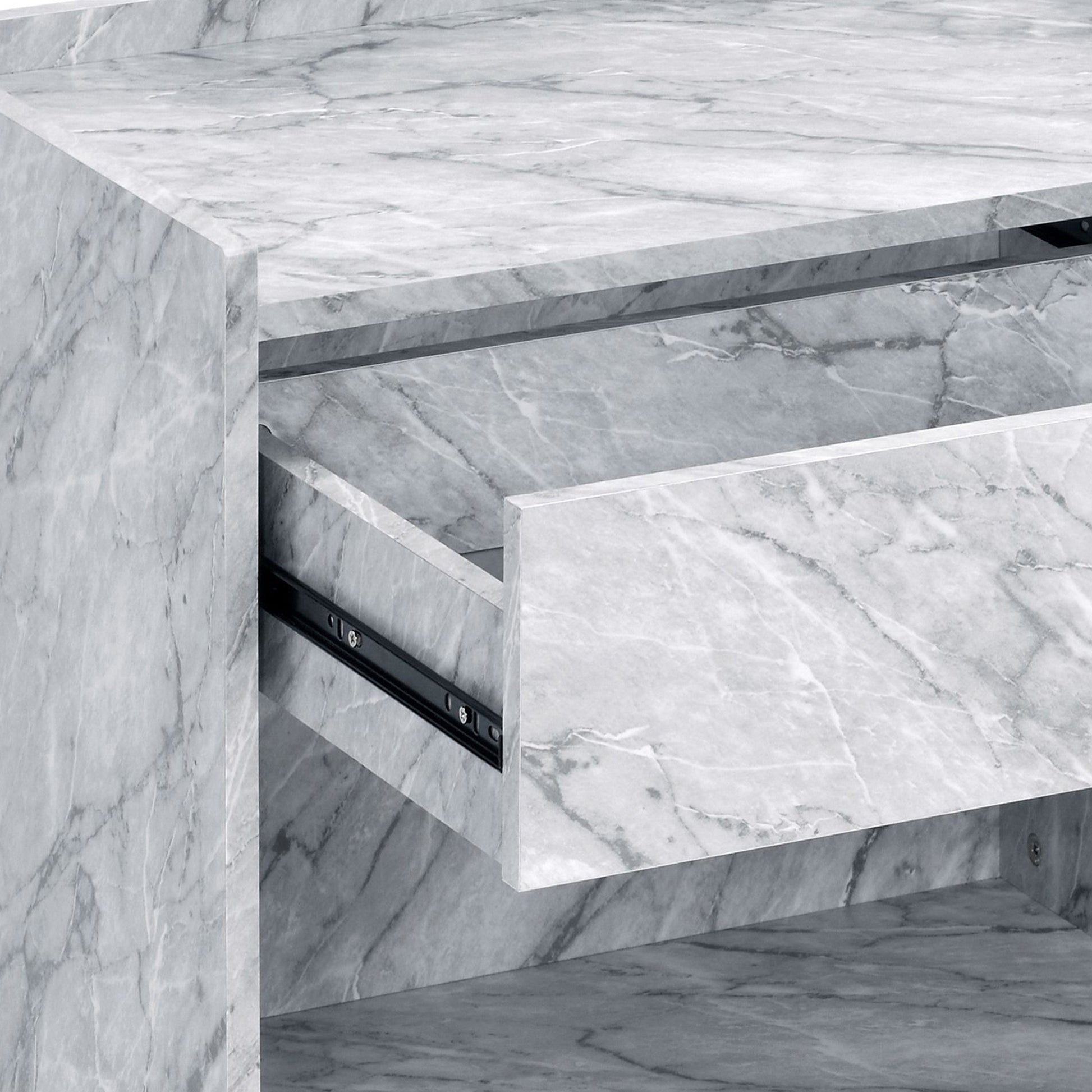 White marble cabinet with an open drawer revealing black metal runners