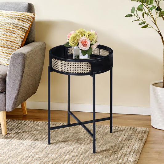 Round black metal end table with natural rattan inlay and faux roses