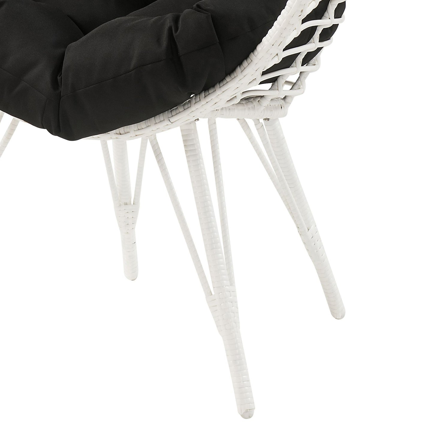 White rattan armchair with plush black seat cushion modern outdoor furniture