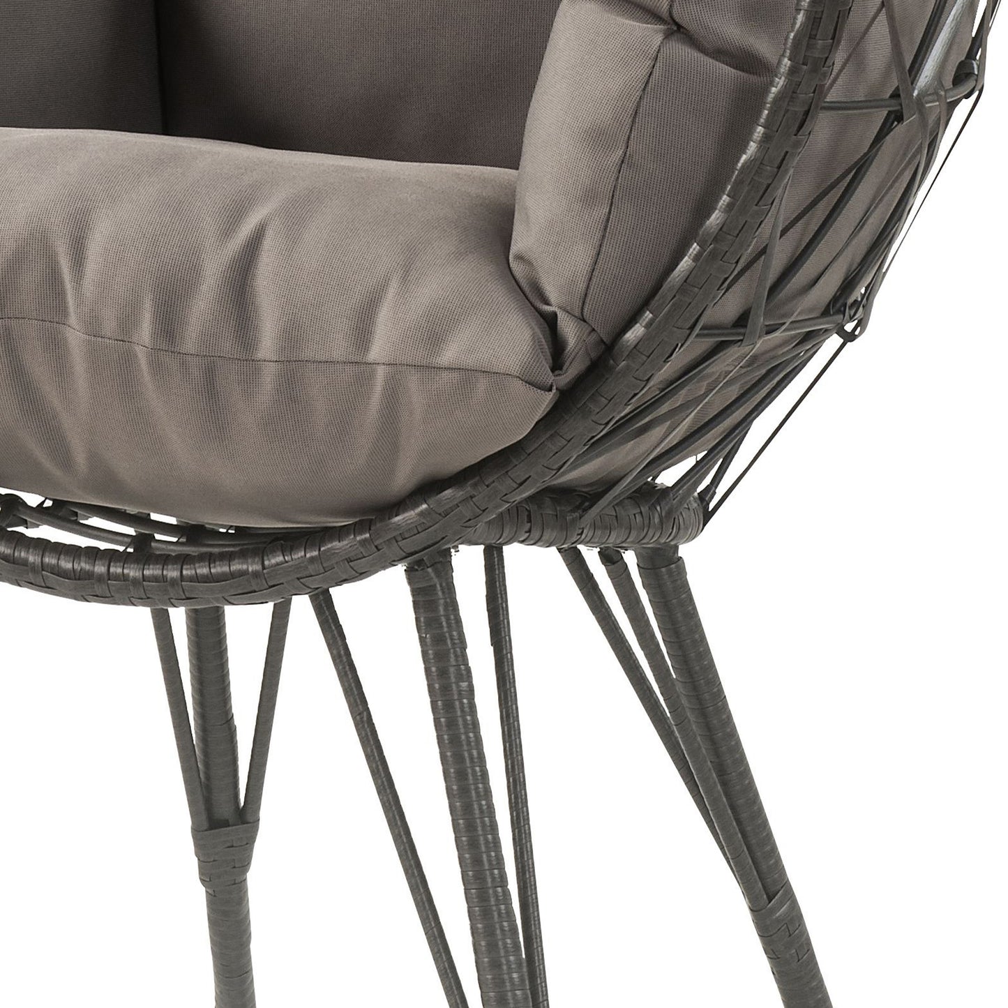 Closeup of a gray woven wicker chair with plush seat cushions and dark metal legs