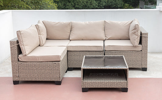 Beige outdoor sectional sofa with neutral cushions durable wicker construction and a matching coffee table