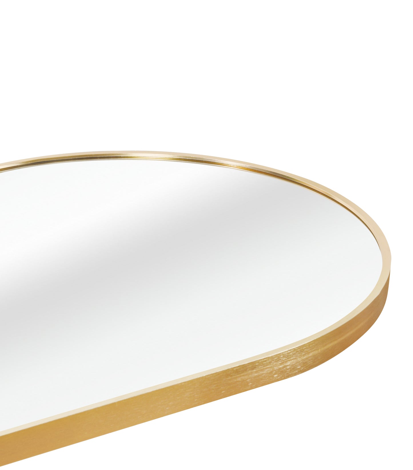 Closeup of a rounded gold framed mirror with brushed metal texture