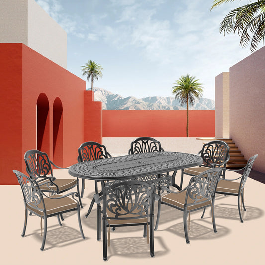 Ornate black cast aluminum oval dining table with six chairs perfect for patio gatherings