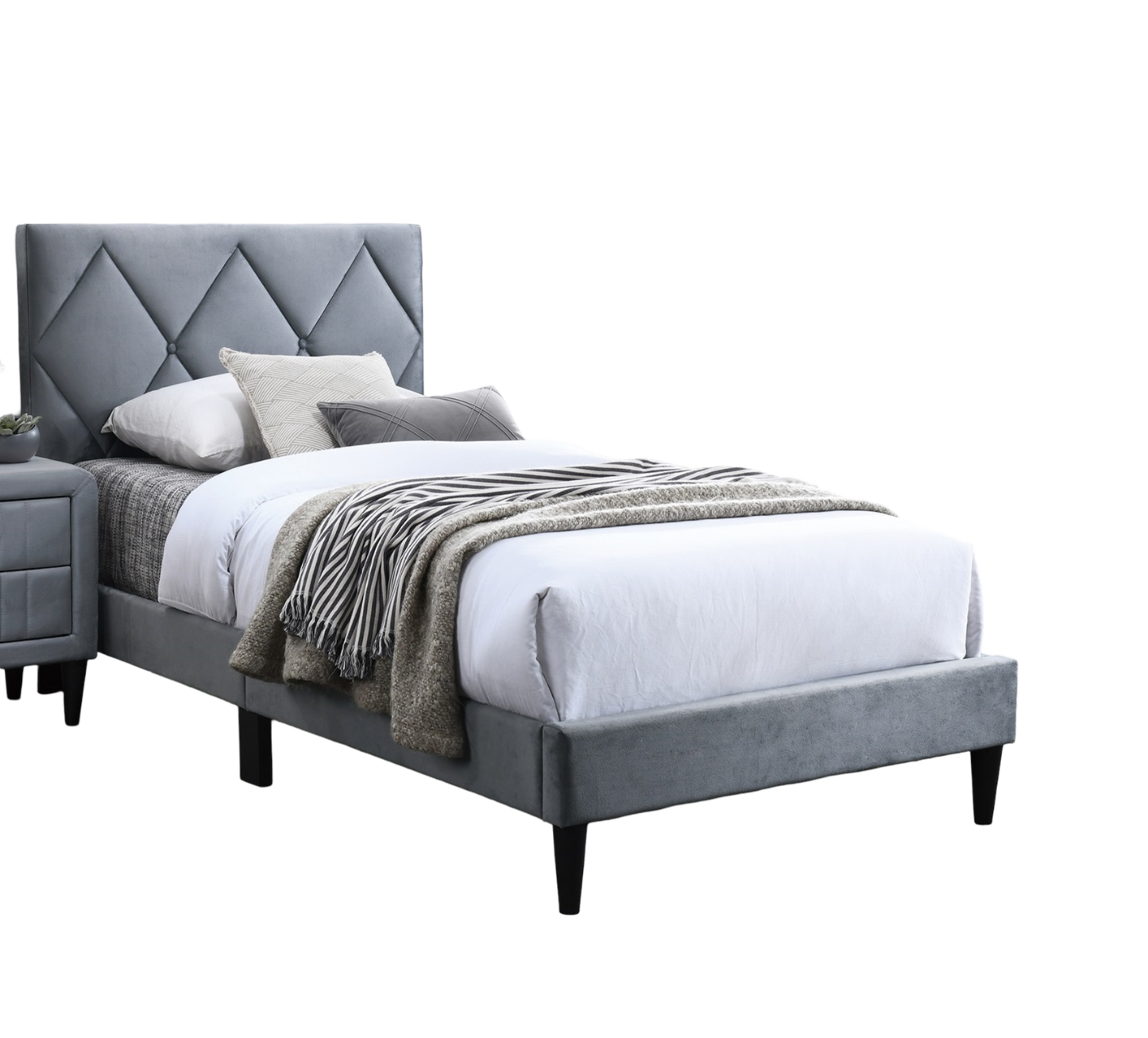 Gray velvet platform bed with diamond tufted headboard and matching nightstand