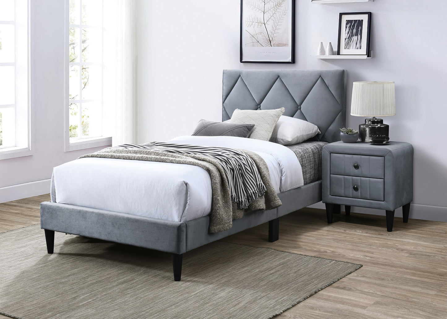 Grey velvet twin bed with diamond tufted headboard and black tapered legs