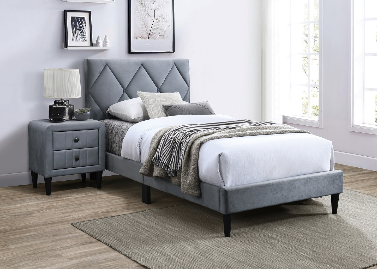 Gray upholstered twin bed with diamond tufting