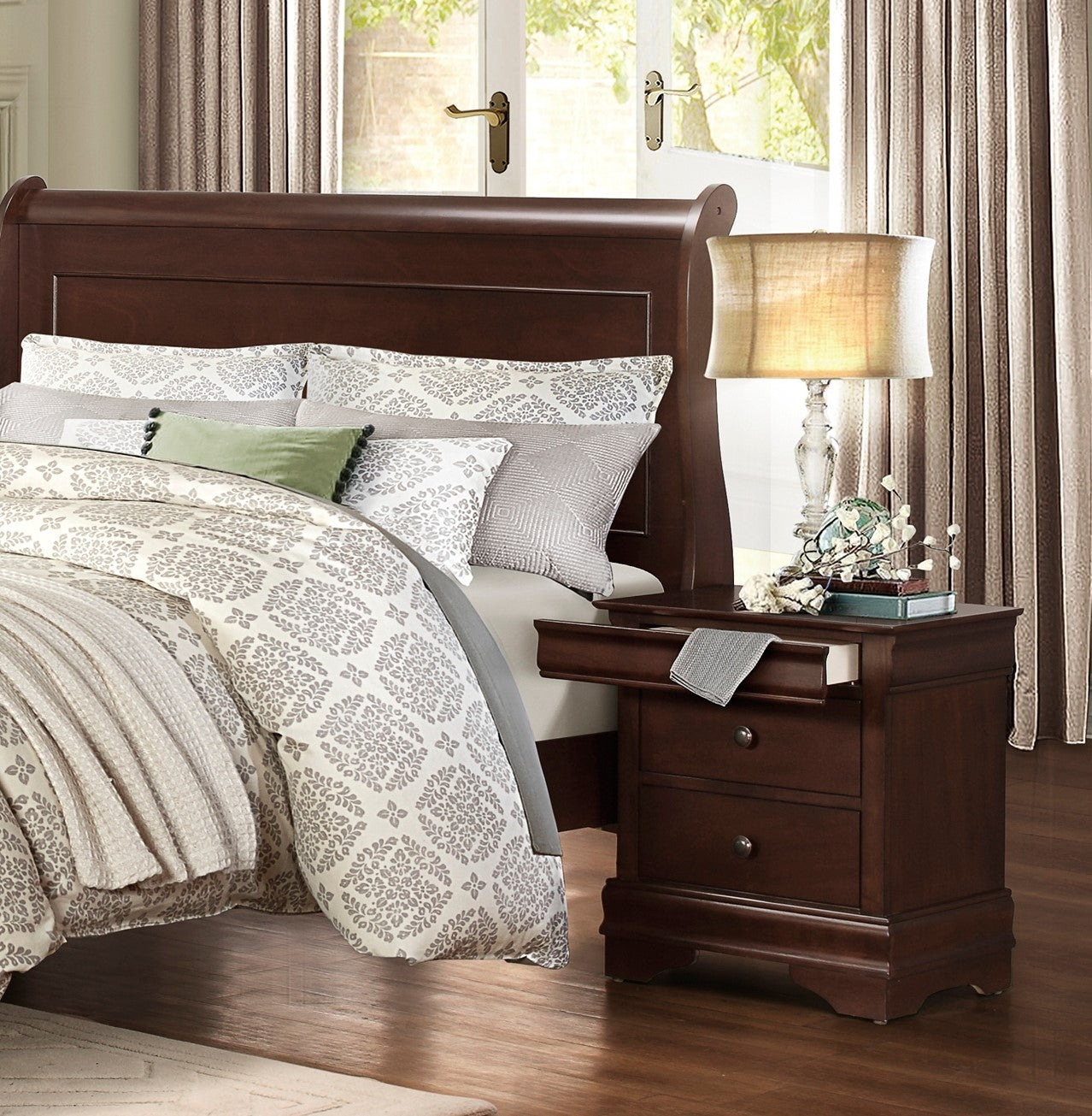 Dark cherry sleigh bed frame with plush grey and white damask bedding