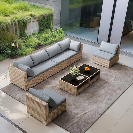 Modular outdoor sofa set with grey cushions and woven rattan base ideal for patios