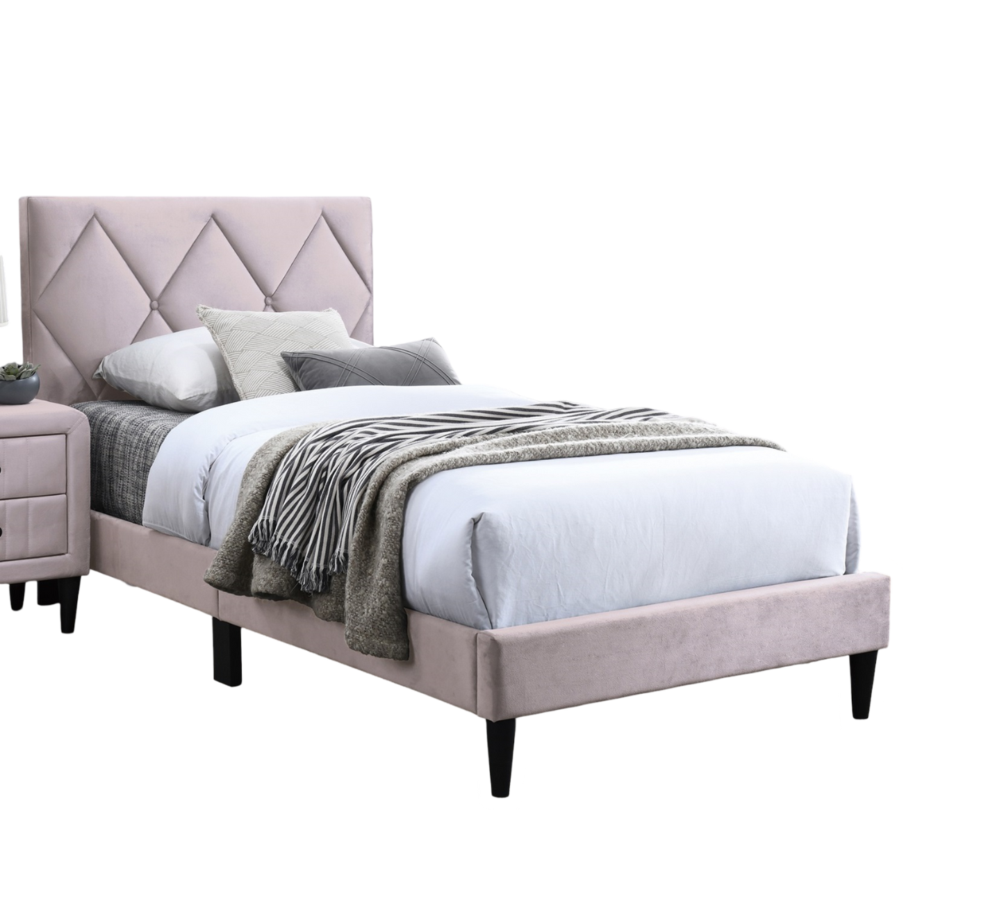 Light pink velvet upholstered bed frame with diamond tufting on headboard