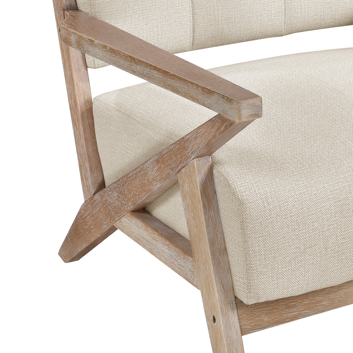 Close up of a natural linen upholstered armchair with weathered oak wood frame