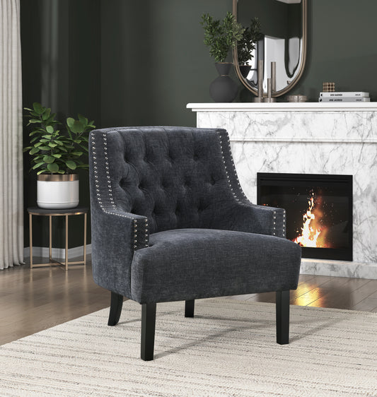 Dark grey tufted armchair with nailhead trim and dark wooden legs perfect accent chair