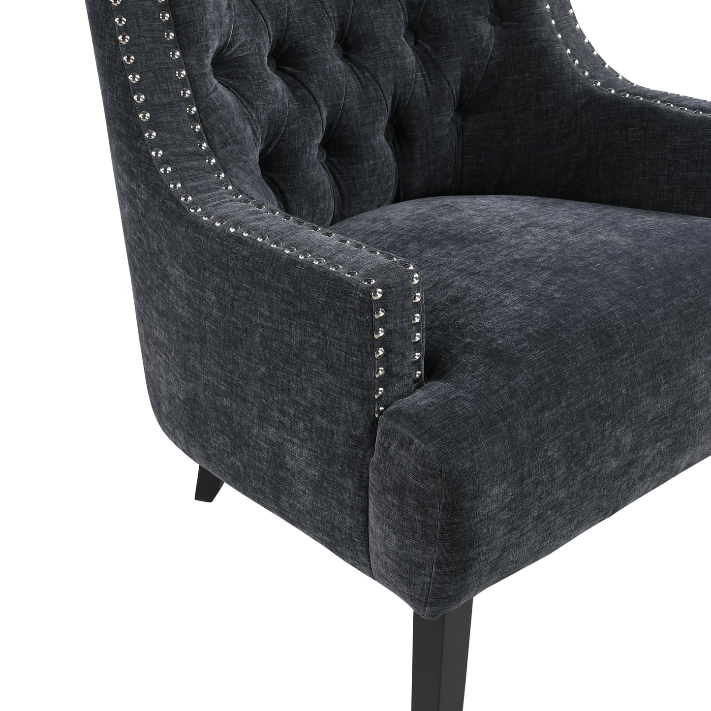 Dark gray upholstered accent chair with diamond tufting and silver nailhead trim