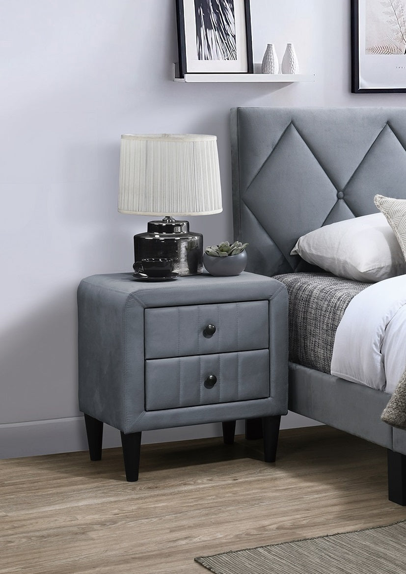 Grey upholstered nightstand with two drawers and black knobs