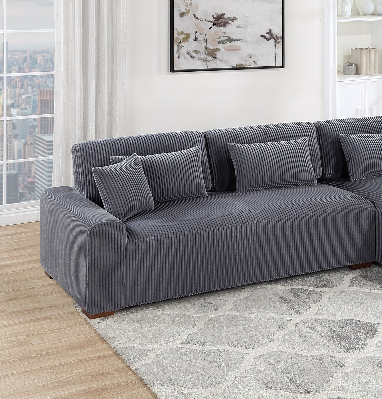 Gray corduroy sectional sofa with plush throw pillows ideal for living rooms