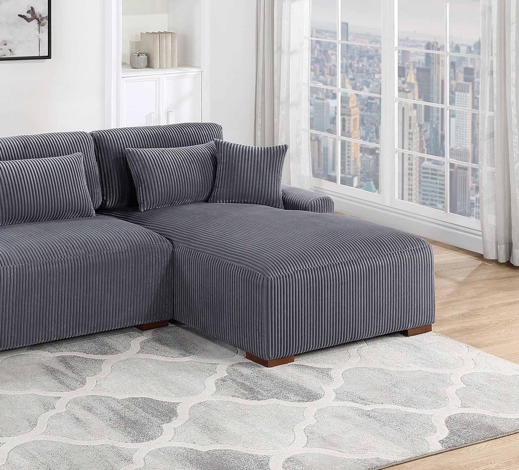 Grey corduroy sectional sofa with chaise lounge and throw pillows