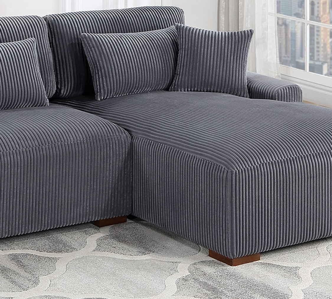 Grey corduroy sectional sofa with plush cushions and wooden legs perfect for living rooms