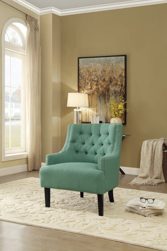 Teal tufted accent chair with silver nailhead trim and dark wood legs