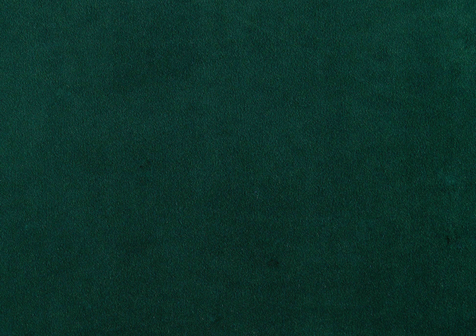 Deep forest green velvet fabric swatch for upholstery projects