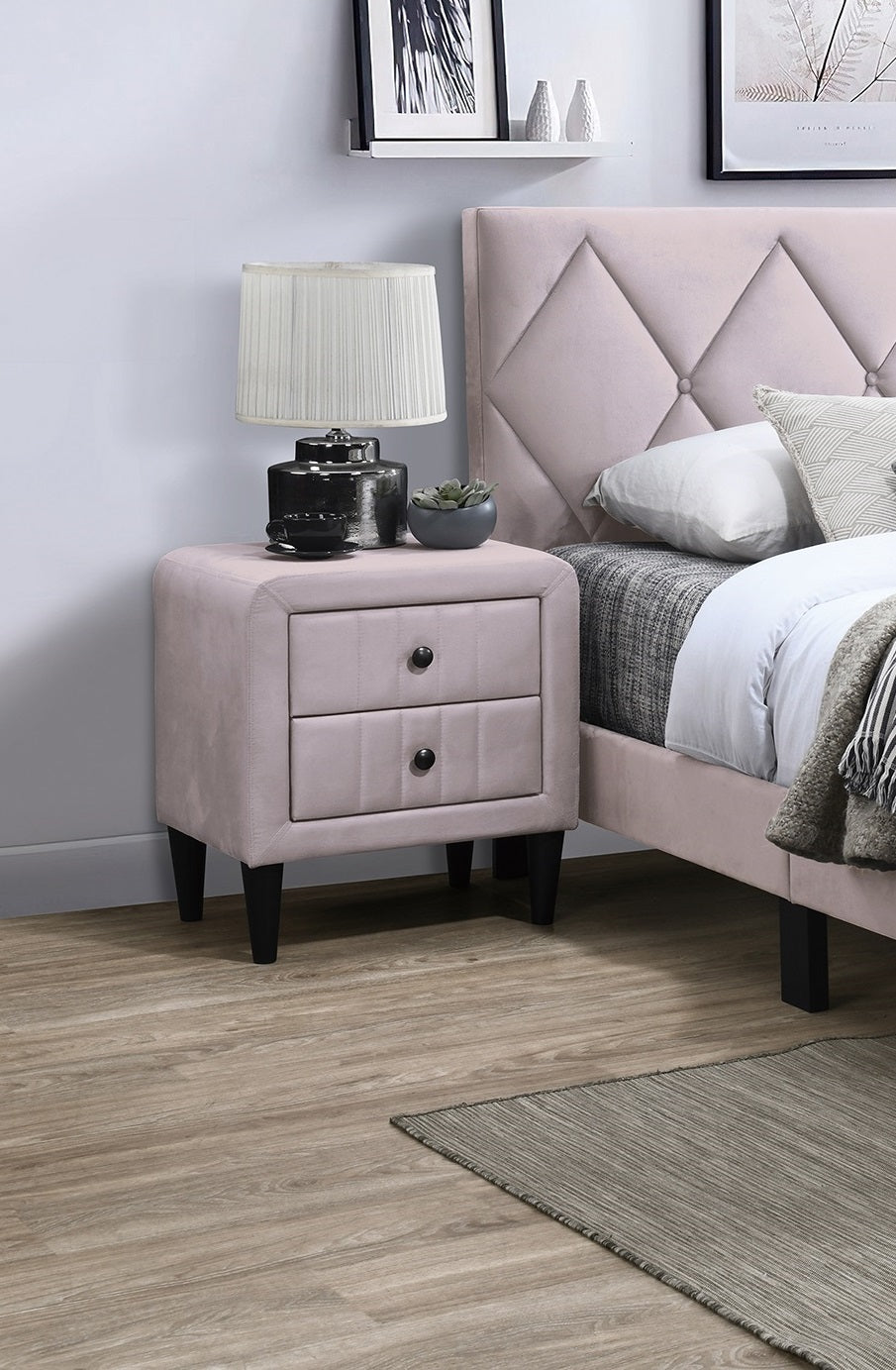 Pink velvet nightstand with two drawers and black knobs