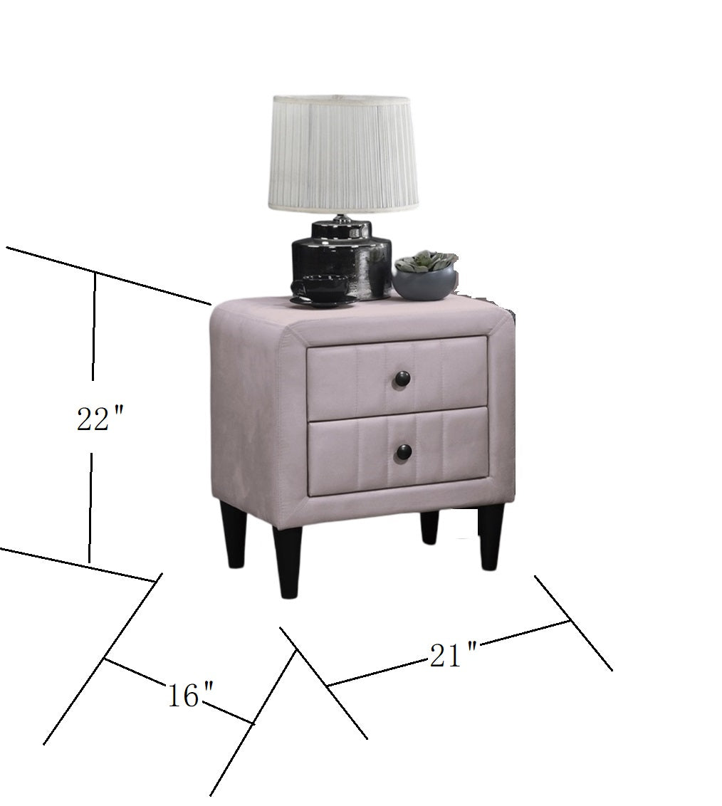 Plush grey velvet twodrawer nightstand with black knob pulls and tapered legs