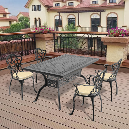 Ornate black cast iron patio dining set with beige cushions for outdoor entertaining