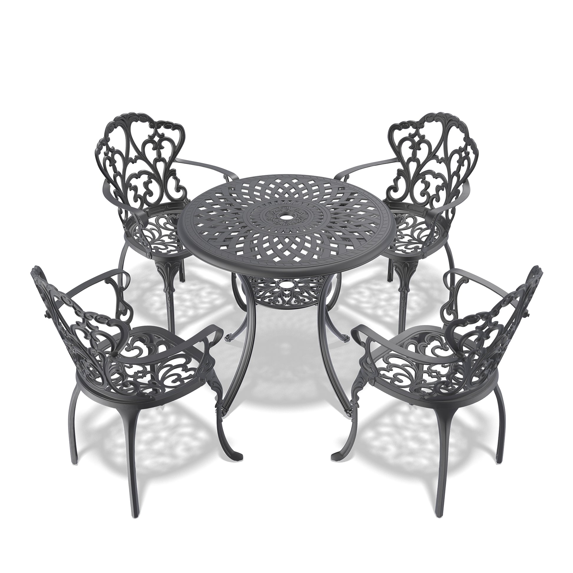 Ornate dark grey cast iron bistro set with intricate scrollwork for outdoor dining