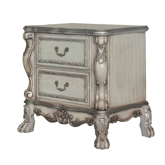 Creamy white ornate nightstand with two drawers and silver hardware